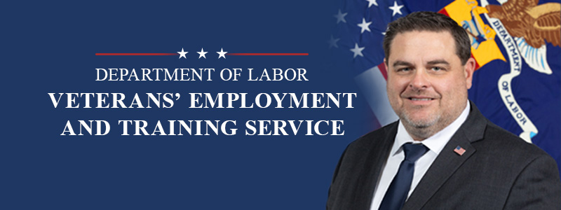 Veterans' Employment and Training Service - official portrait shows a white man in a suit in front of the Labor Department flag