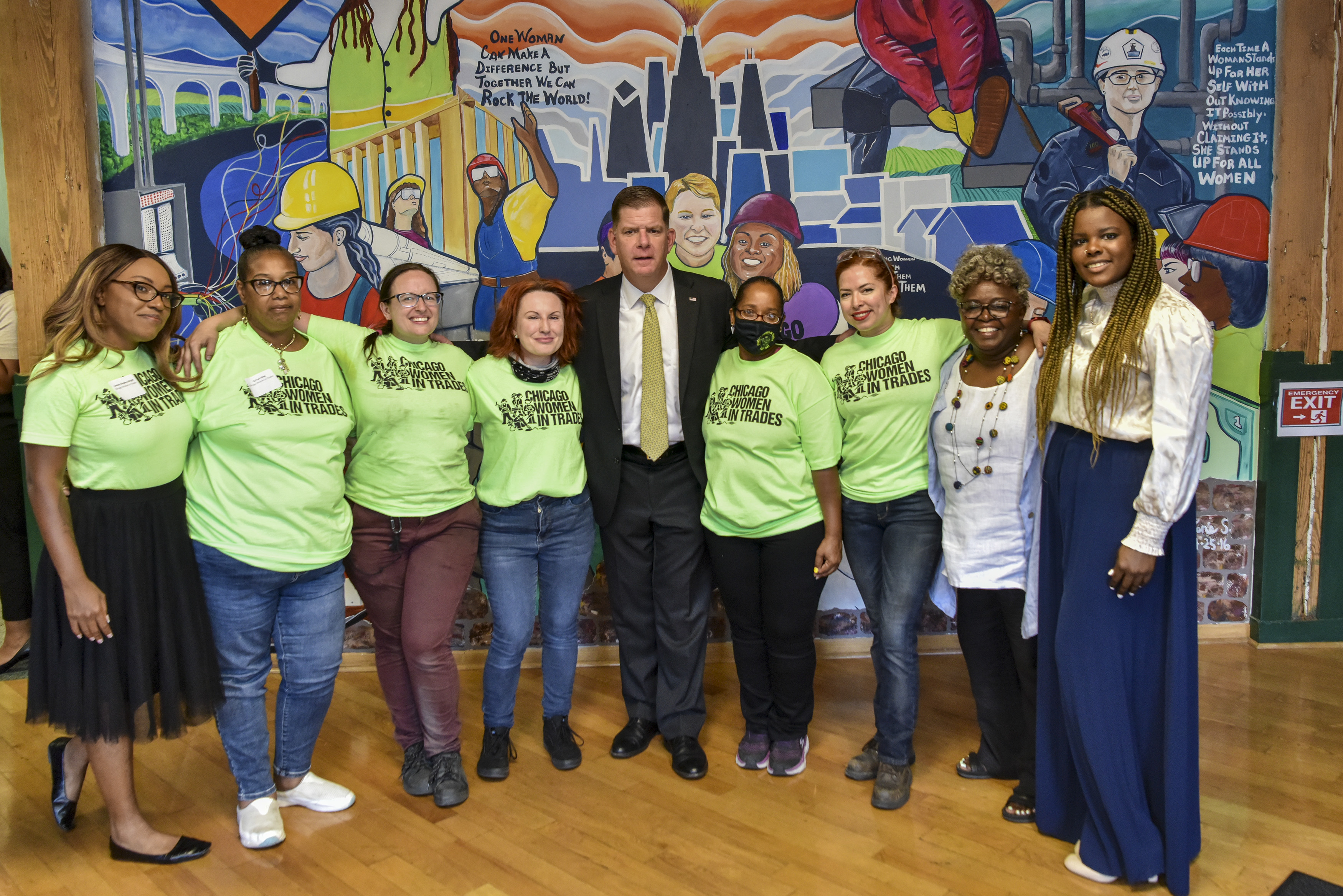 Secretary Walsh stands with a group of grantees.