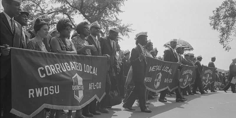 Marchers carrying labor union banners during the March on Washington in 1963