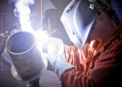 Alt text: Graphic shows a veteran welding. National Hire a Veteran Day. July 25, 2020. 