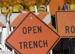 Road sign that says "open trench"