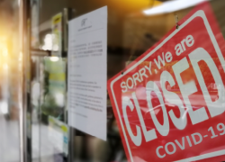 Photo: A storefront has a closed sign.