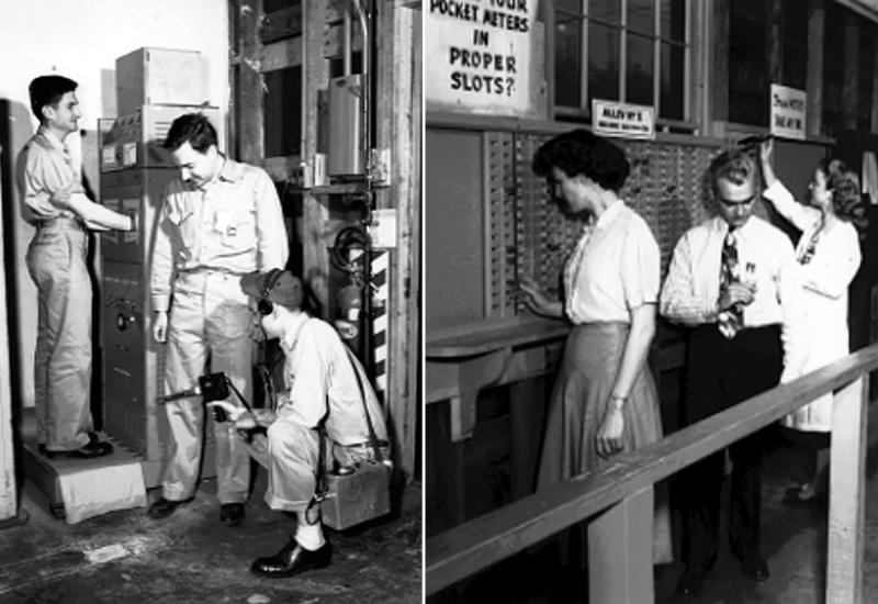 Two black and white photos. On the left, three men in uniforms check for radioactive contaminants using handheld machinery and a large early computer-type device. On the right, one male and two female workers place small devices into slots in a cabinet along a wall. A sign reads, “Are your pocket meters in proper slots?