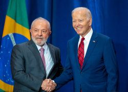 President Biden shaking hands with President Lula in front of the Brazilian flag. Credit: White House photo