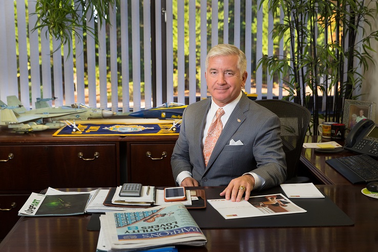 A veteran sits at his desk.