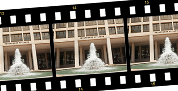 A strip of film bearing the image of the Frances Perkins Building’s exterior.