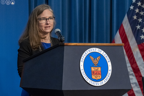 White House Deputy Chief Technology Officer Denice Ross speaks at a podium with the Labor Department seal