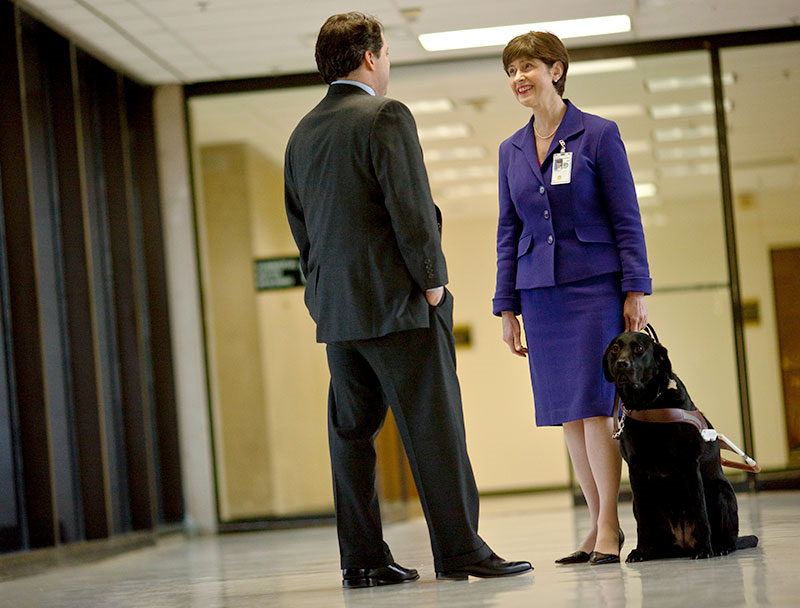 Kathy Peery, a legislative affairs specialist for a federal agency, and her service dog.
