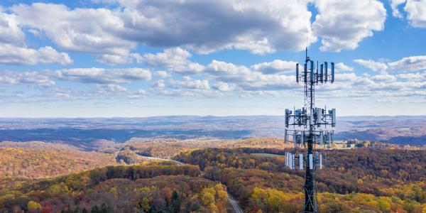 Cell phone or mobile service tower in forested area of West Virginia providing broadband service - stock photo