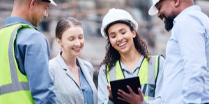 A diverse collection of construction workers on a worksite.