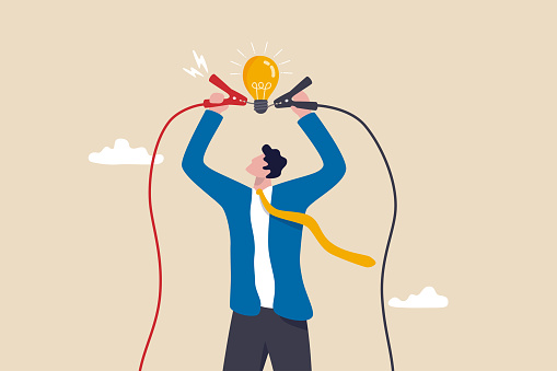 Graphic of a man holding a lightbulb over his head with jumper cables.