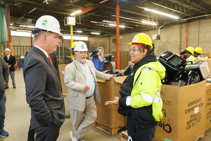 Labor Secretary Walsh (left) and RecycleForce founder Gregg Keesling (center) speak with a female student at one of RecycleForce’s training facilities in Indianapolis, Indiana.