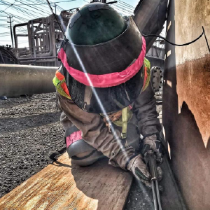 Photo of a woman working outside.