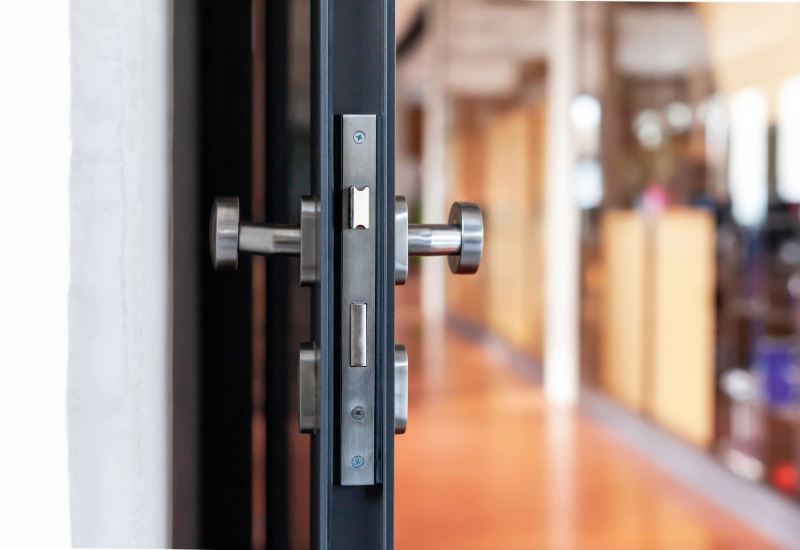 Open door to a sunlit office.   