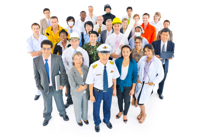 A group of white and blue collar professionals in various uniforms and business attire standing huddled together for a photo with a white background.