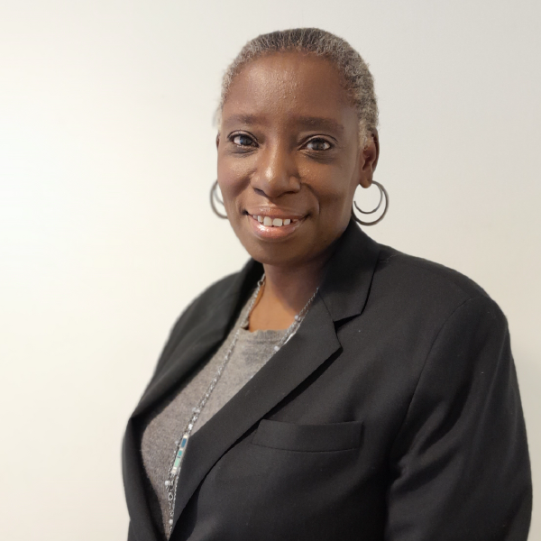 Professional head shot of a woman in a suit.