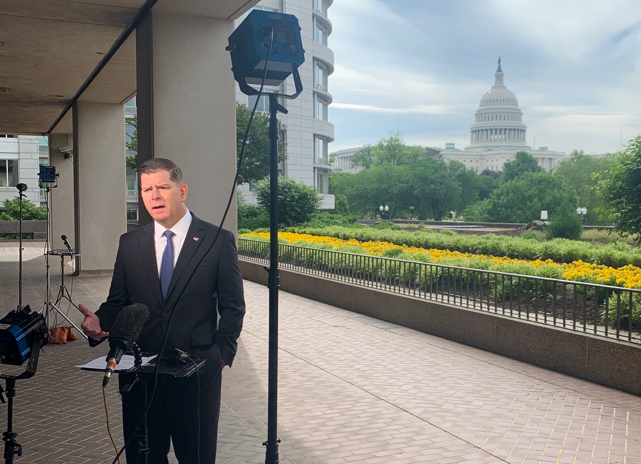 Secretary Walsh films a live interview on Jobs Day.