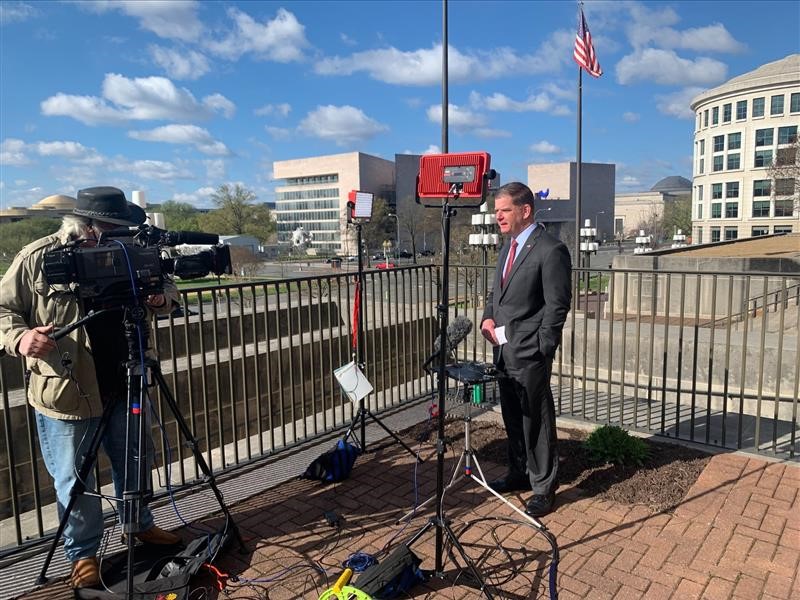 Secretary Marty Walsh prepares for a live media interview.