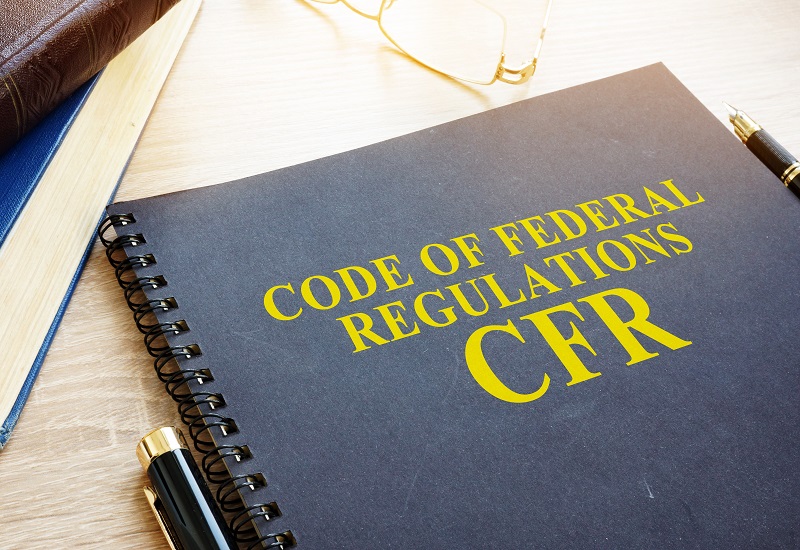 A notebook labeled Code of Federal Regulations, CFR 