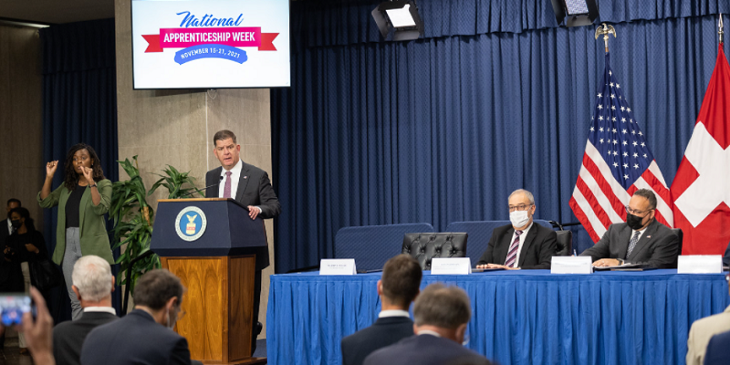 Secretary of Labor Marty Walsh, Swiss President Guy Parmelin, Secretary of Education Miguel Cardona and Deputy Secretary of Commerce Don Graves attend a Memorandum of Understanding signing ceremony at the US Department of Labor.