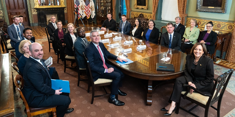 Members of the White House Task Force on Worker Organizing and Empowerment, including former Secretary Marty Walsh and Vice President Kamala Harris, with employers and unions sit around a large table in an ornate room at the White House.