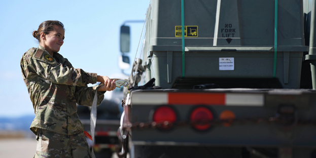 An airman secures a munitions kit to a flatbed truck at Ellsworth Air Force Base, S.D., Oct. 21, 2019. Photo credit: Air Force Airman 1st Class Christina Bennett
