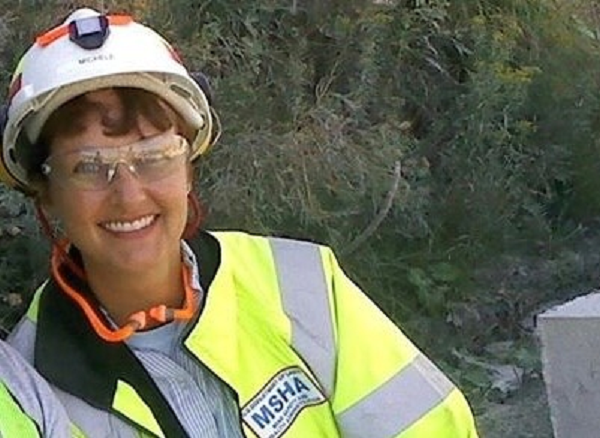 Michele Santos-Cranford wearing a hardhat and a reflective vest with the MSHA logo