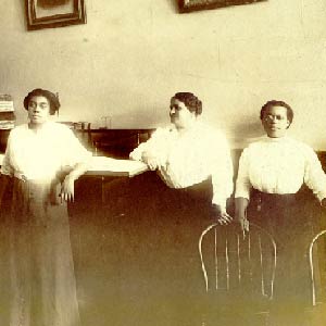 Sepia photo of Maggie Walker and some of the women she employed. 
