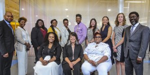 Women's Bureau Director Wendy Chun-Hoon poses with 12 participants from a roundtable in Birmingham, Alabama