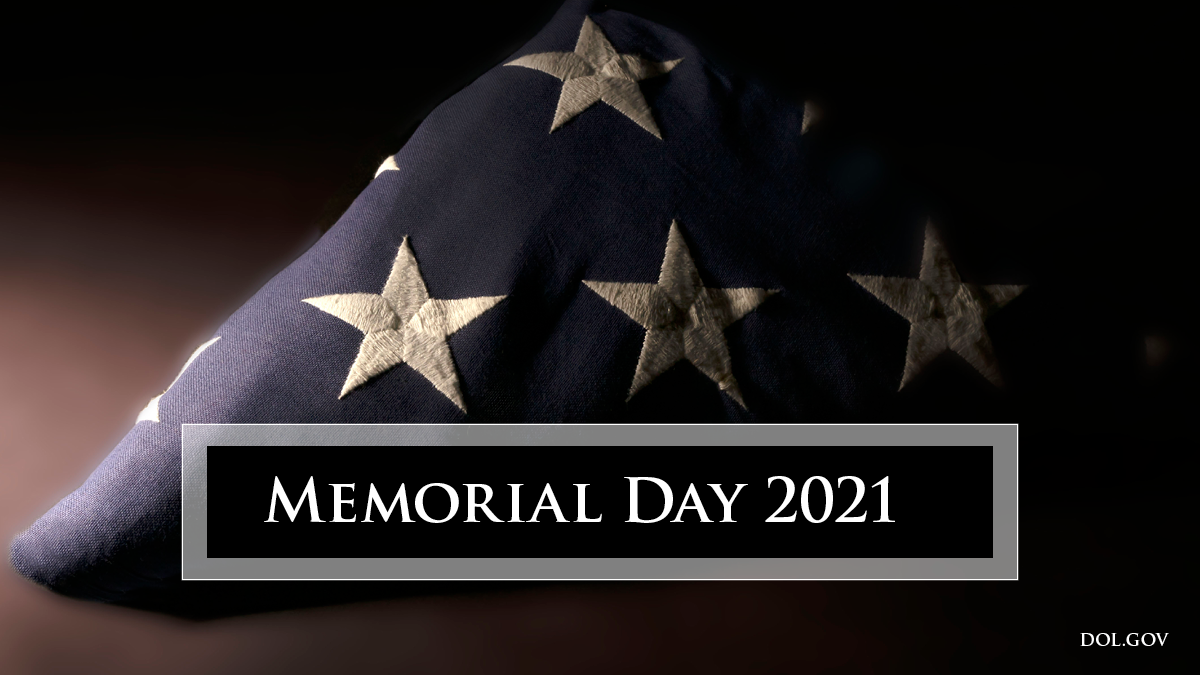 A folded flag with the text Memorial Day 2021