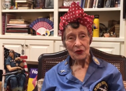  Frances Tunnell Carter, a riveter on B-29s in WWII, sits in a room full of Rosie the Riveter memorabilia.