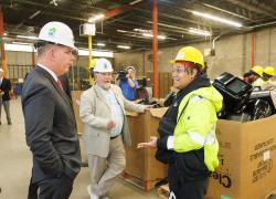 Labor Secretary Walsh (left) and RecycleForce founder Gregg Keesling (center) speak with a female student at one of RecycleForce’s training facilities in Indianapolis, Indiana.