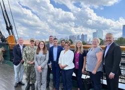Deputy Assistant Secretary Margarita Devlin and the DOL VETS staff smile as they enjoy a tour of the USS Constitution in Boston, Mass.