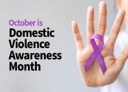 October is Domestic Violence Awareness Month. Image of a woman holding up her hand, palm forward, and a purple domestic violence awareness ribbon.
