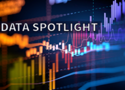 Data Spotlight. A chart moving upwards is in the background.