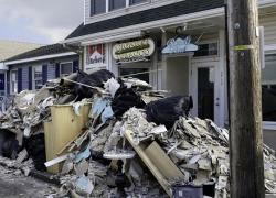 An image of the aftermath of a hurricane with debris scattered.