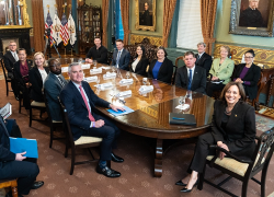 Members of the White House Task Force on Worker Organizing and Empowerment, including former Secretary Marty Walsh and Vice President Kamala Harris, sit around a large table in an ornate room at the White House.