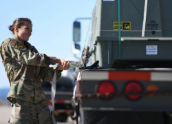 An airman secures a munitions kit to a flatbed truck at Ellsworth Air Force Base, South Dakota, Oct. 21, 2019. Photo by Air Force Airman 1st Class Christina Bennett.