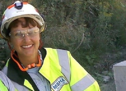 Michele Santos-Cranford wearing a hardhat and a reflective vest with the MSHA logo