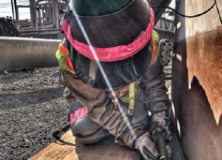 Photo of a woman working outdoors.