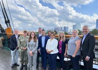 Deputy Assistant Secretary Margarita Devlin and the DOL VETS staff smile as they enjoy a tour of the USS Constitution in Boston, Mass.