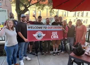 Workers at New Flyer celebrate their employer's voluntary recognition of their union.