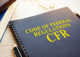 A notebook labeled Code of Federal Regulations, CFR 