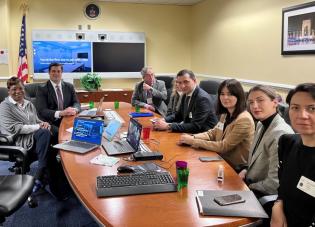 A few members of the Office of Labor-Management Standards seated around long oval table